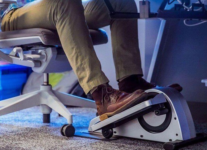 Stay fit while working an office job with under desk ellipticals, hydration reminders, and portable strength devices